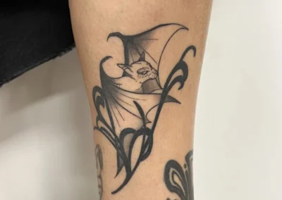 Tatouage d'une chauve souris sur le bras